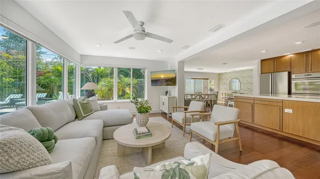 a large kitchen with kitchen island granite countertop a large counter top appliances and a center island