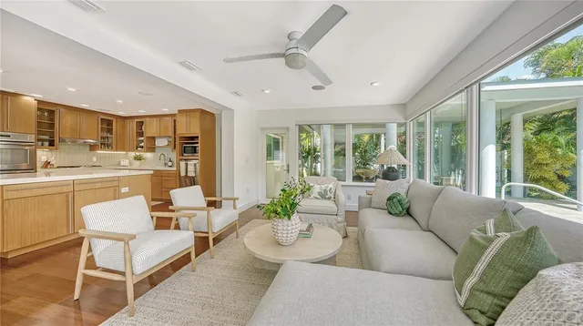 a kitchen with stainless steel appliances granite countertop a lot of counter space and wooden floors