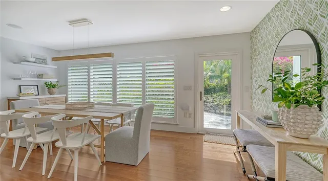 a view of kitchen island with wooden floor and outdoor seating