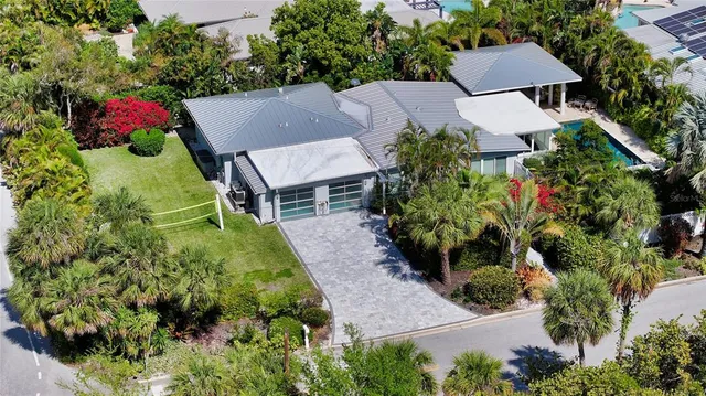 a view of a house with a flower garden