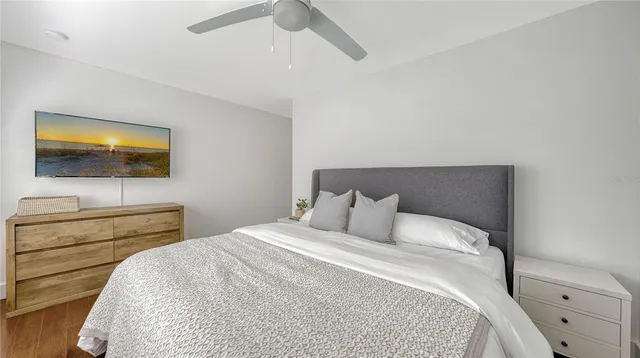 a view of a dining room with furniture large windows and wooden floor