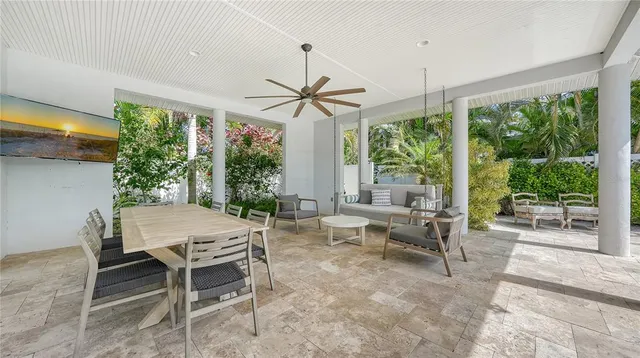 a view of a swimming pool with a potted plants and a chair