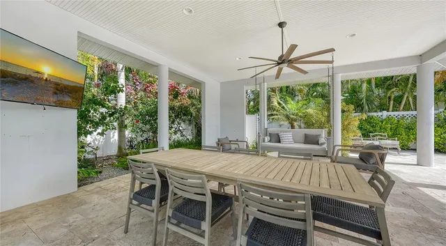 a view of a house with a large tree