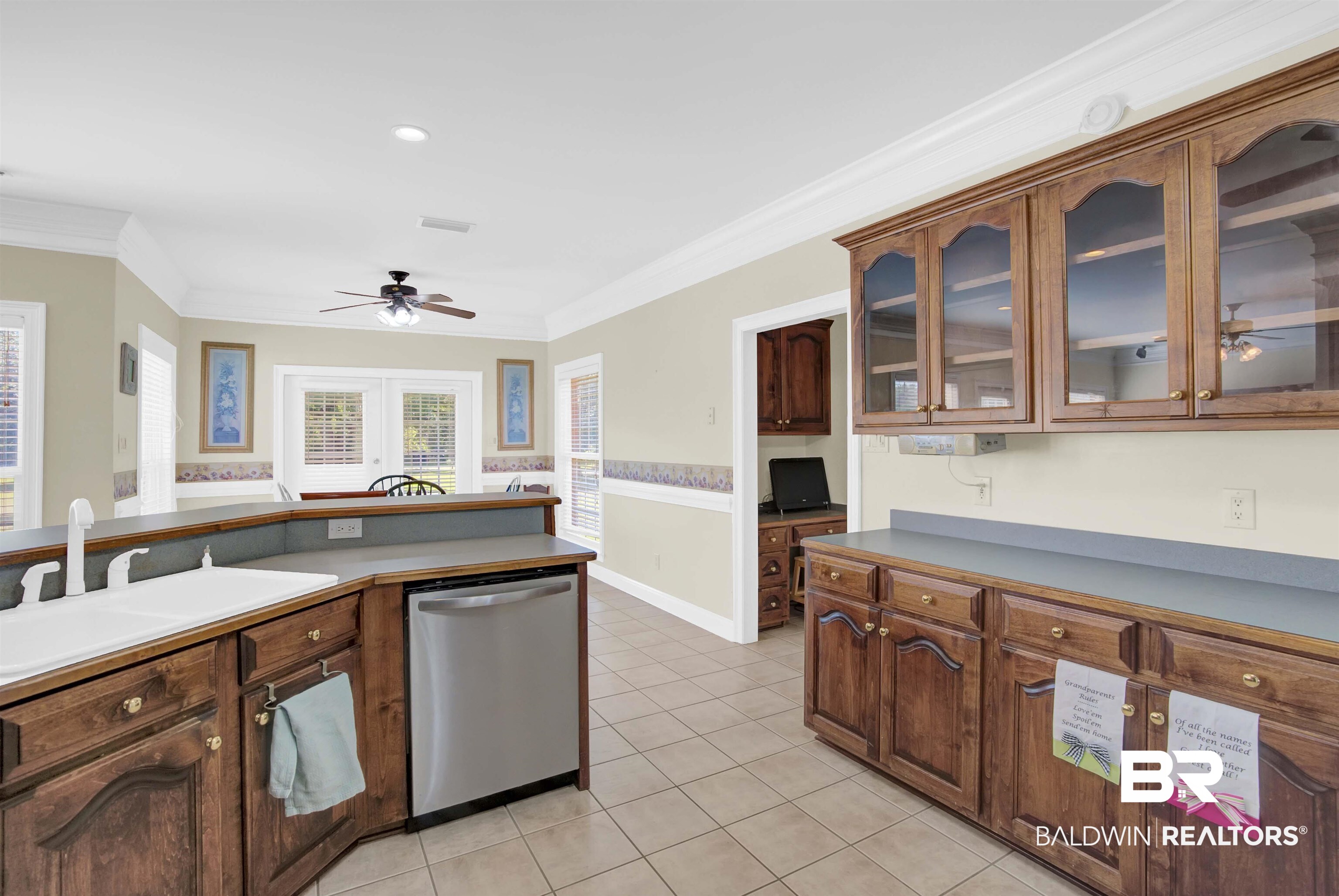 27688 Rigsby Road Daphne, AL 36526 - Photo 19 of 56 Kitchen with light tile patterned floors, dishwasher, ceiling fan, sink, and ornamental molding