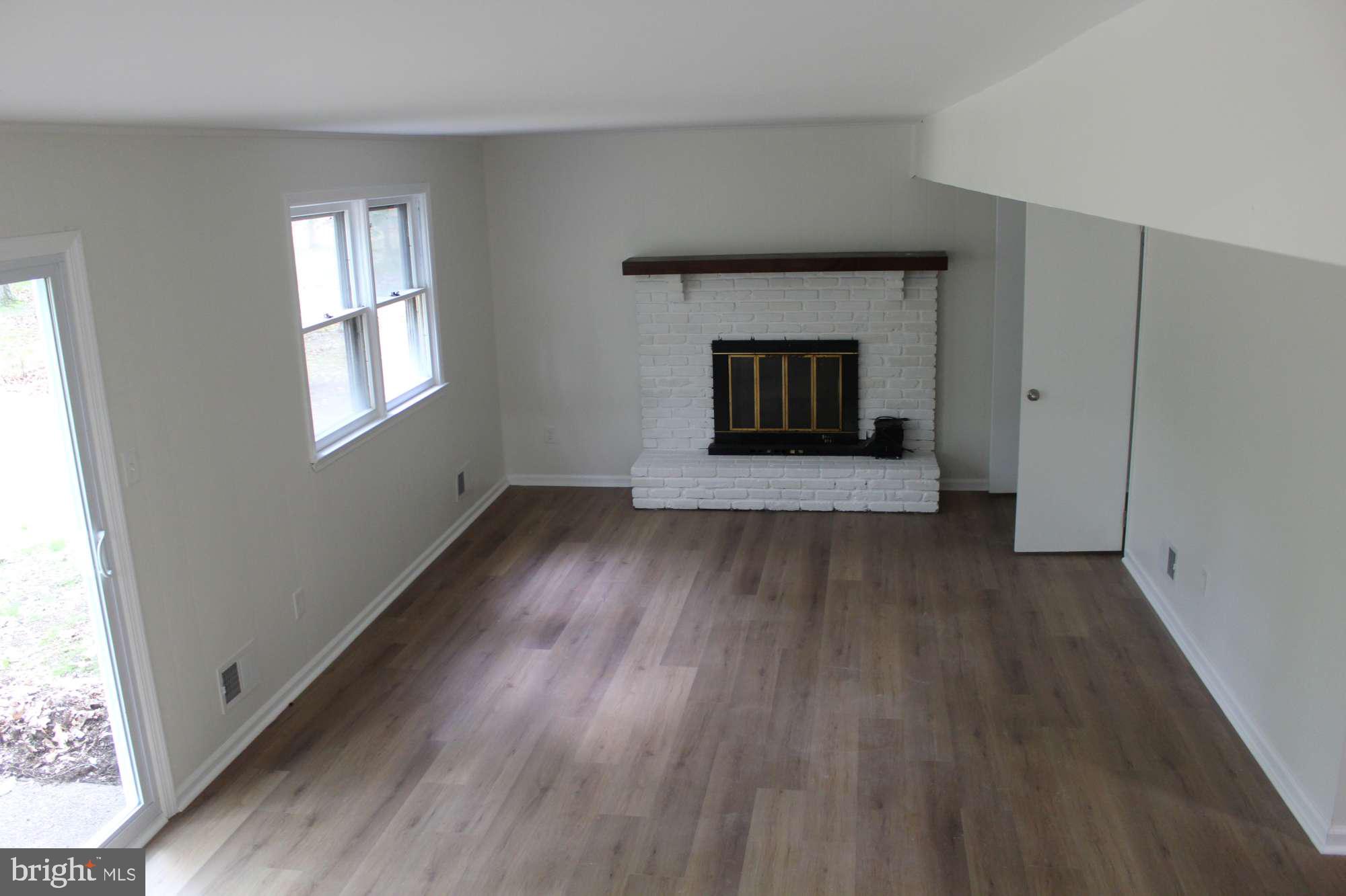 7 Deer Trail Tabernacle, NJ 08088 - Photo 11 of 31 a view of an empty room with wooden floor and a window
