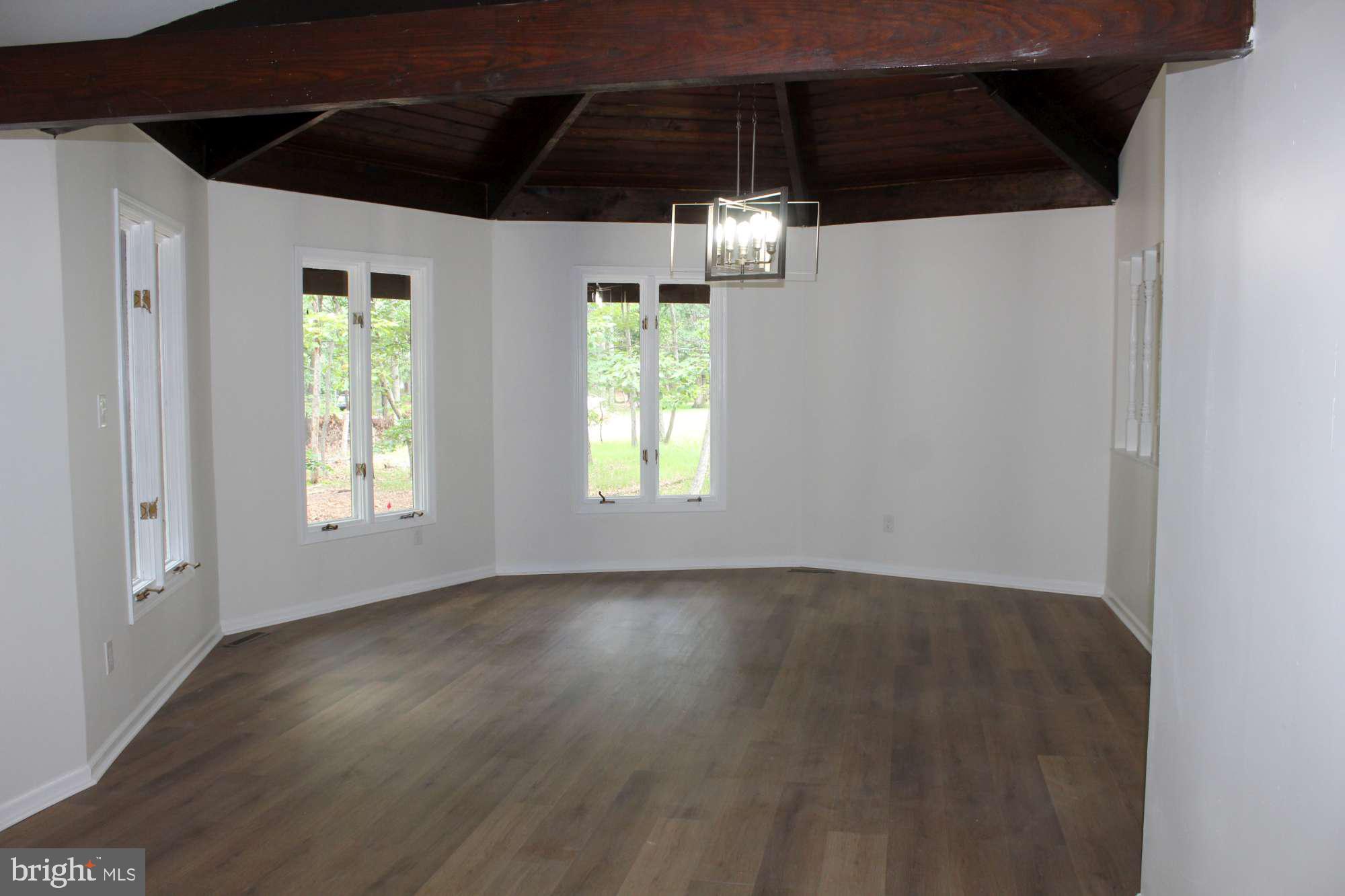 7 Deer Trail Tabernacle, NJ 08088 - Photo 14 of 31 a view of an empty room with wooden floor and windows