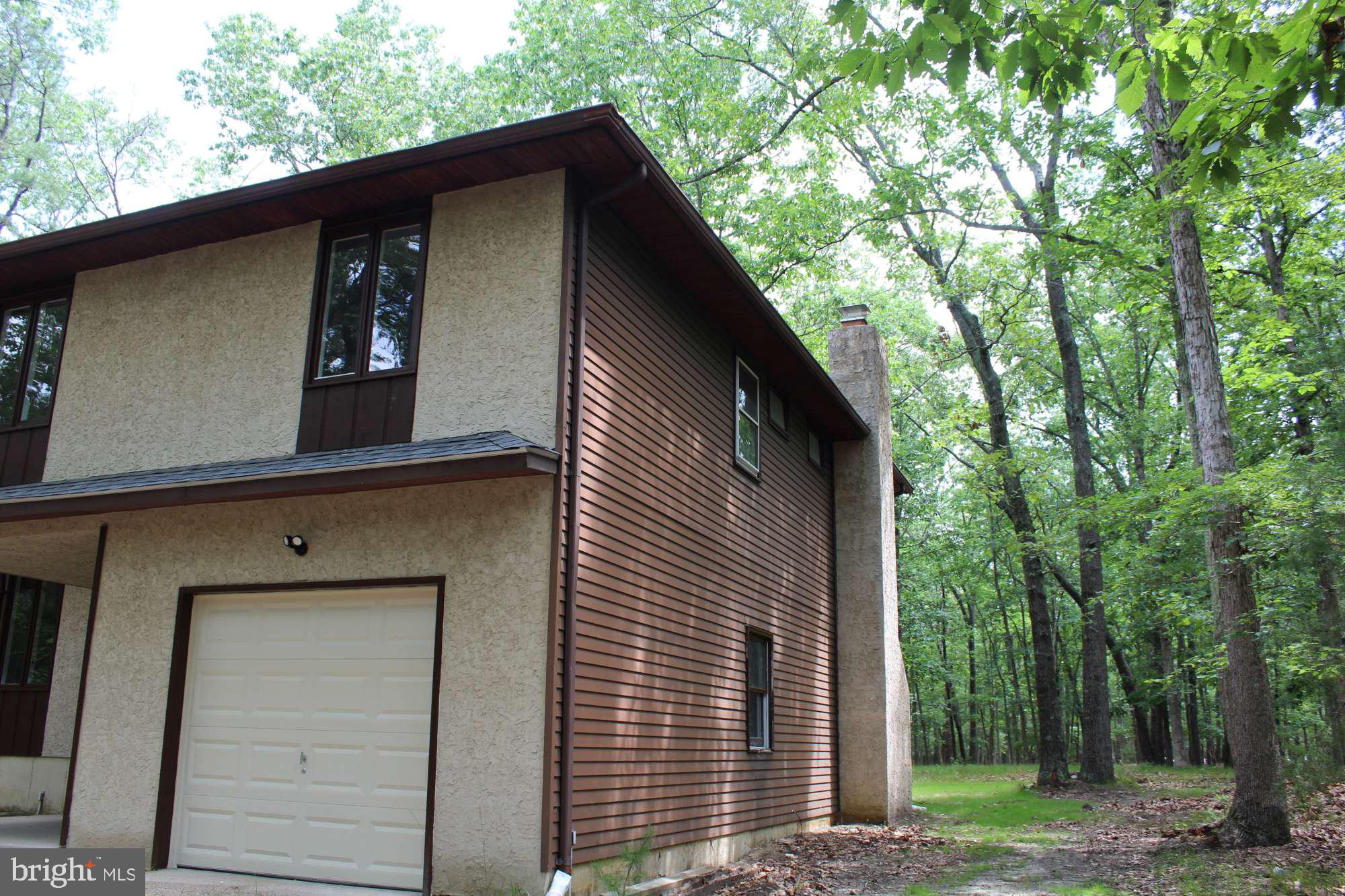 7 Deer Trail Tabernacle, NJ 08088 - Photo 2 of 31 a front view of a house with a garden
