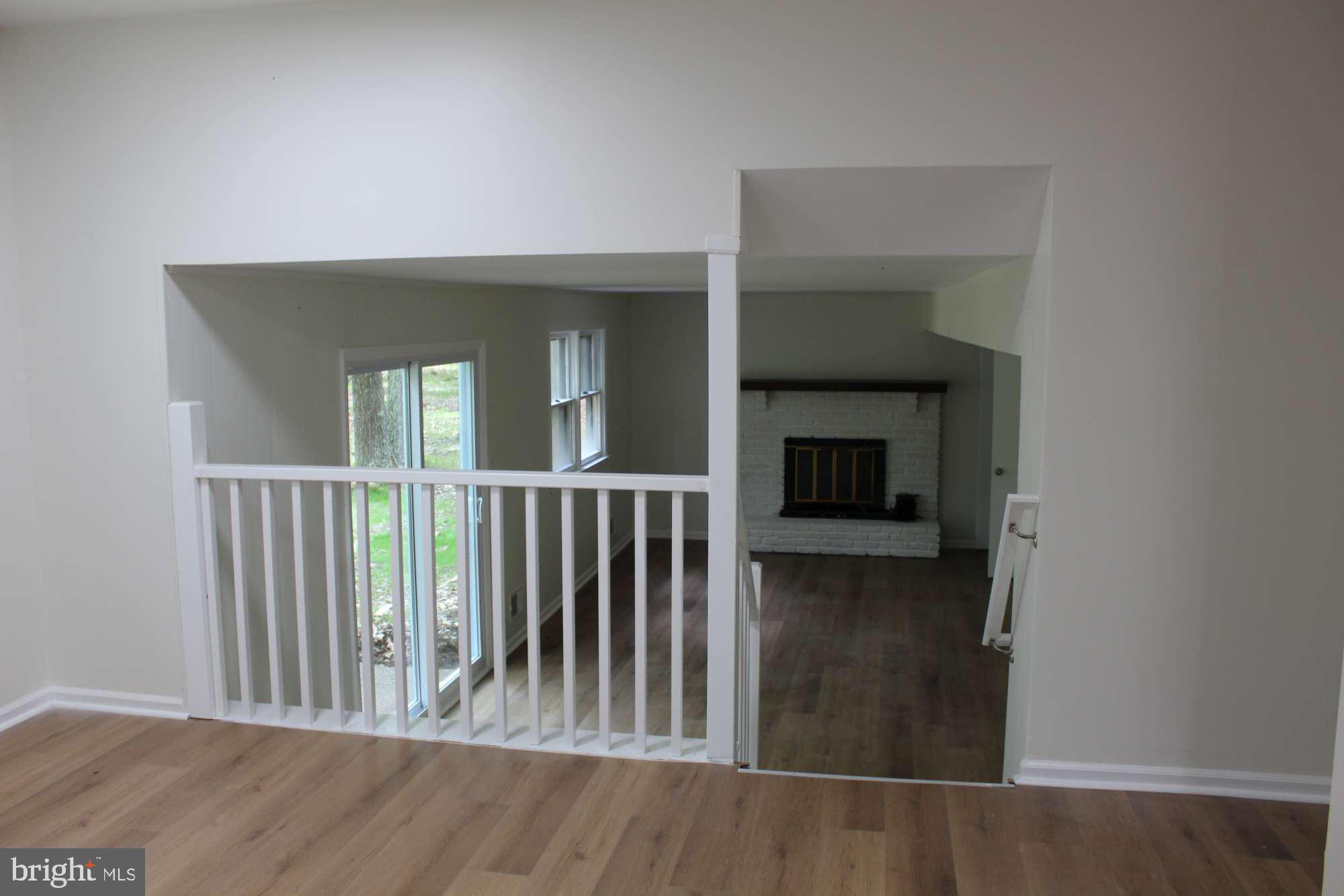 7 Deer Trail Tabernacle, NJ 08088 - Photo 10 of 31 wooden floor in a hall with an entryway door
