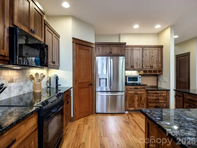 a room with lots of books and a book shelf