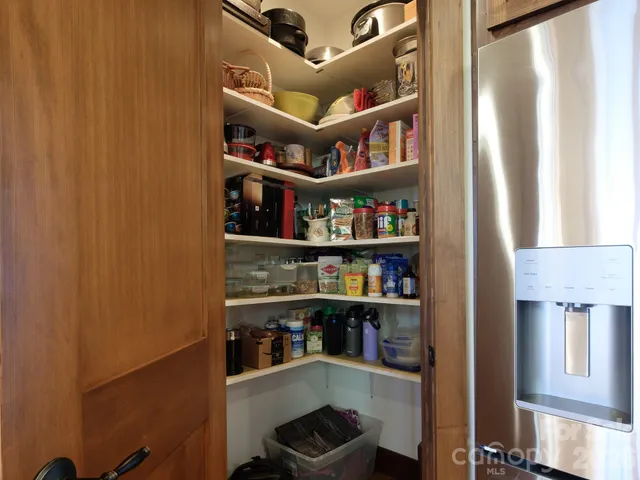 a view of a dining room with furniture large windows and wooden floor