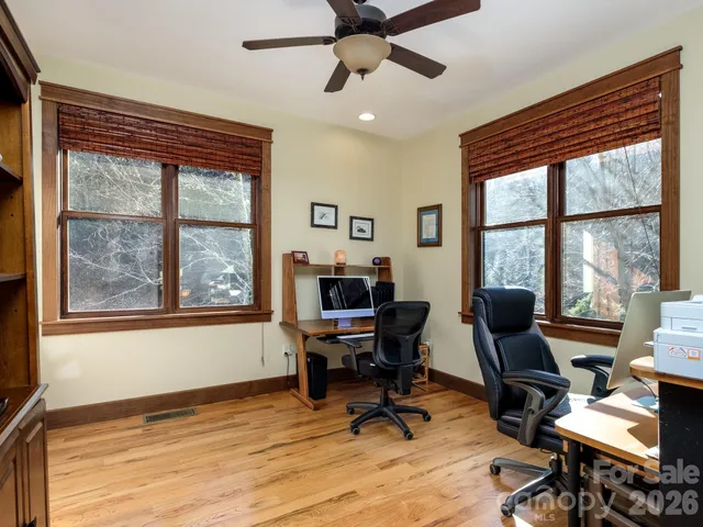 a bedroom with a large bed and a large window