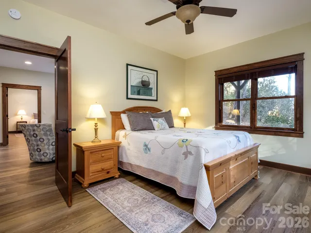 a view of a chairs and table in patio with wooden floor
