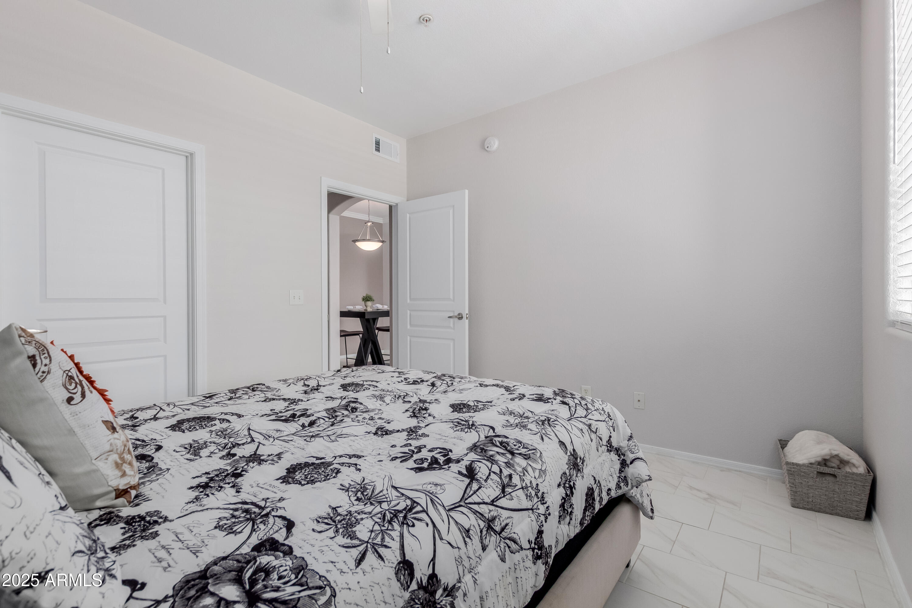 1941 South Pierpont Drive, Unit 1114 Mesa, AZ 85206 - Photo 13 of 34 a bedroom with a bed and a window