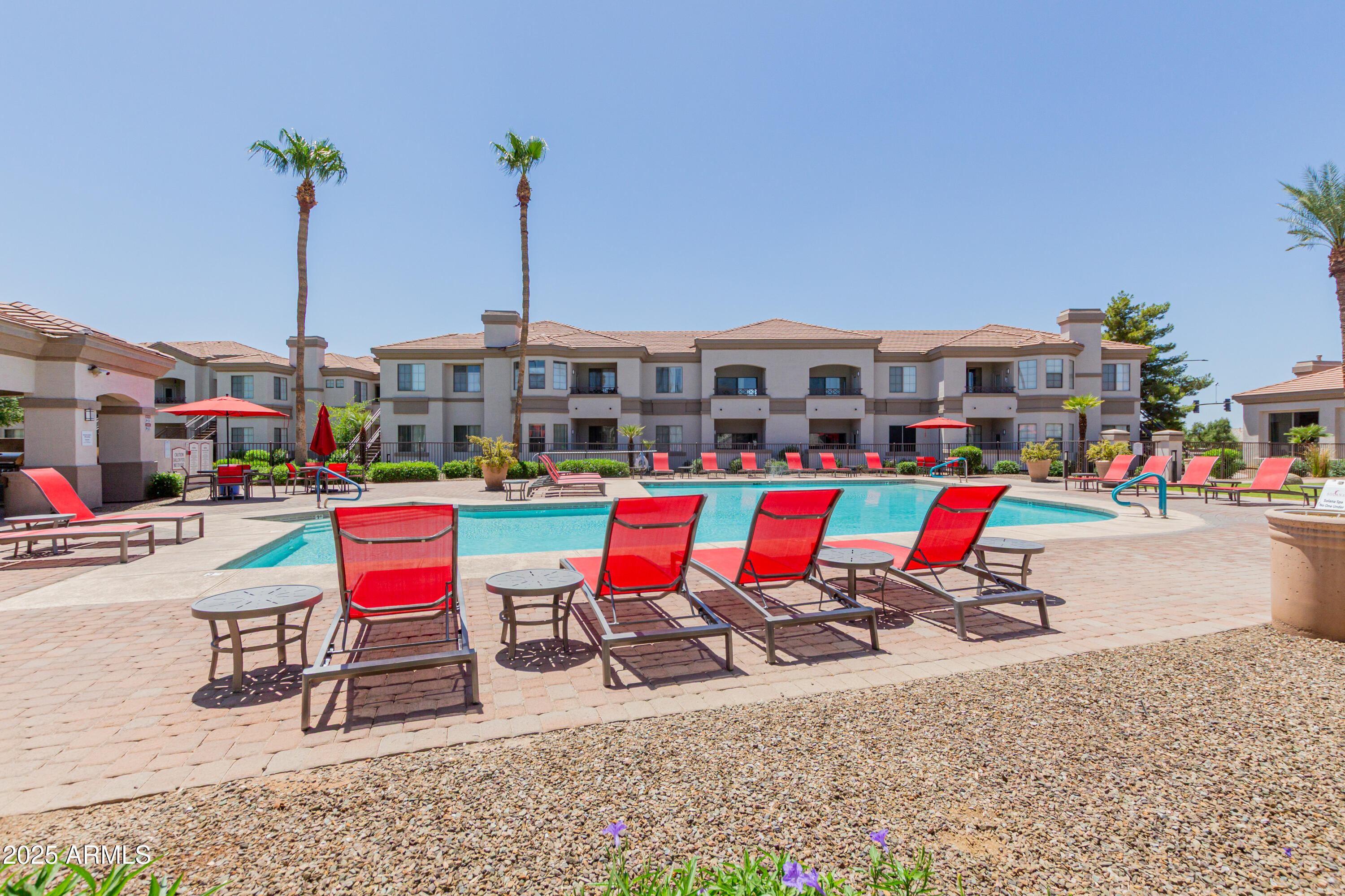1941 South Pierpont Drive, Unit 1114 Mesa, AZ 85206 - Photo 20 of 34 a wooden bench sitting in front of building