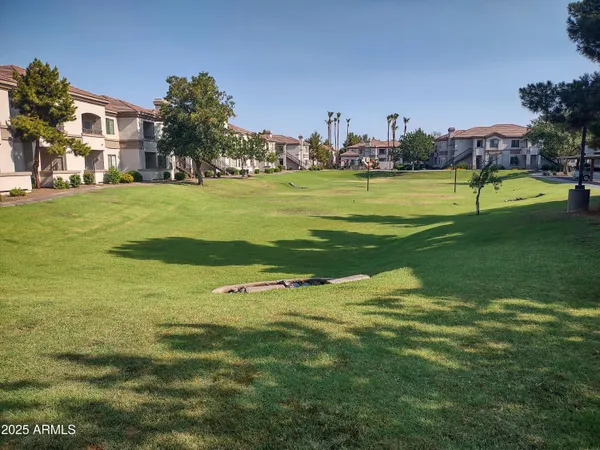 a view of a park with houses