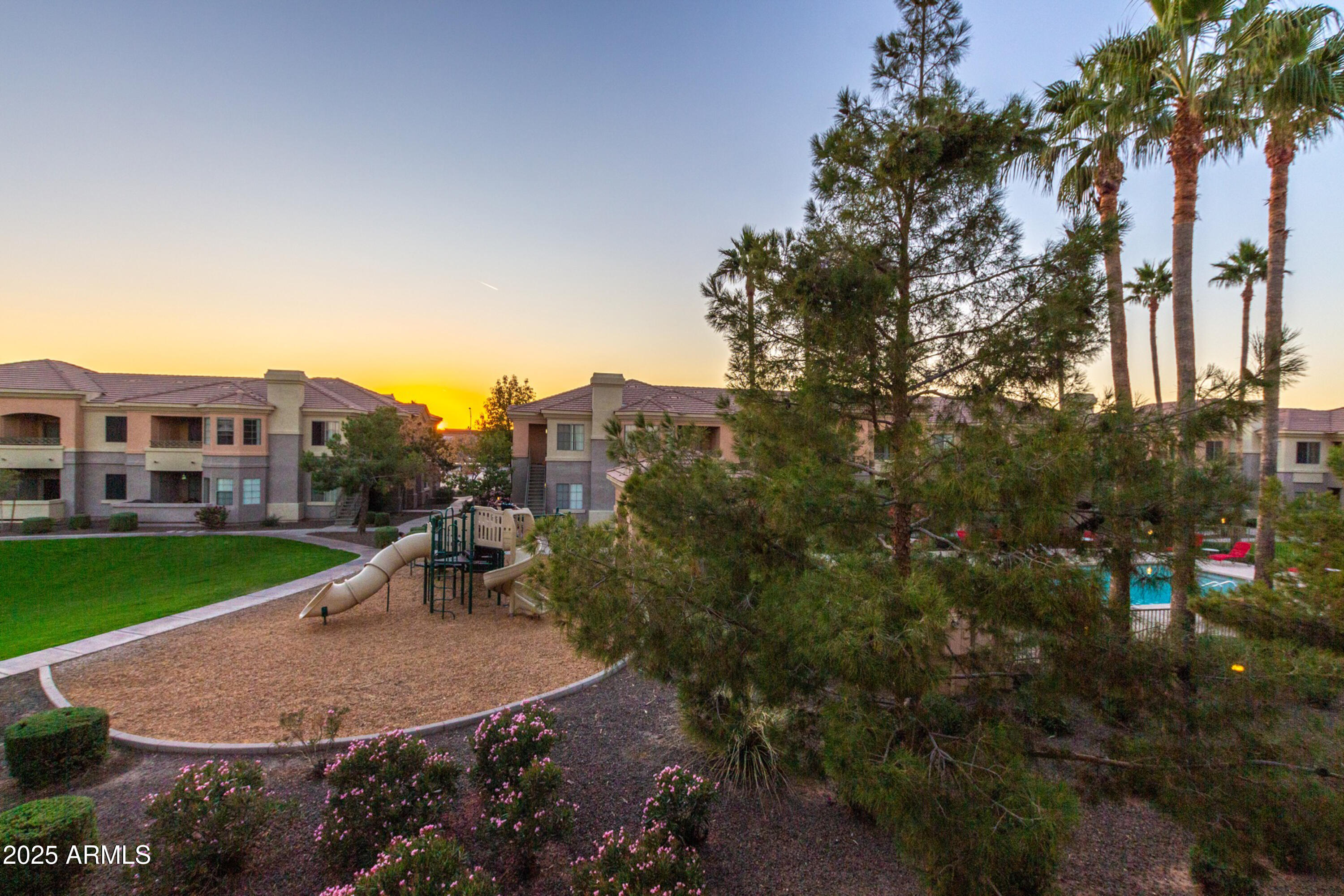 1941 South Pierpont Drive, Unit 1114 Mesa, AZ 85206 - Photo 31 of 34 a view of a house with a backyard and a garden