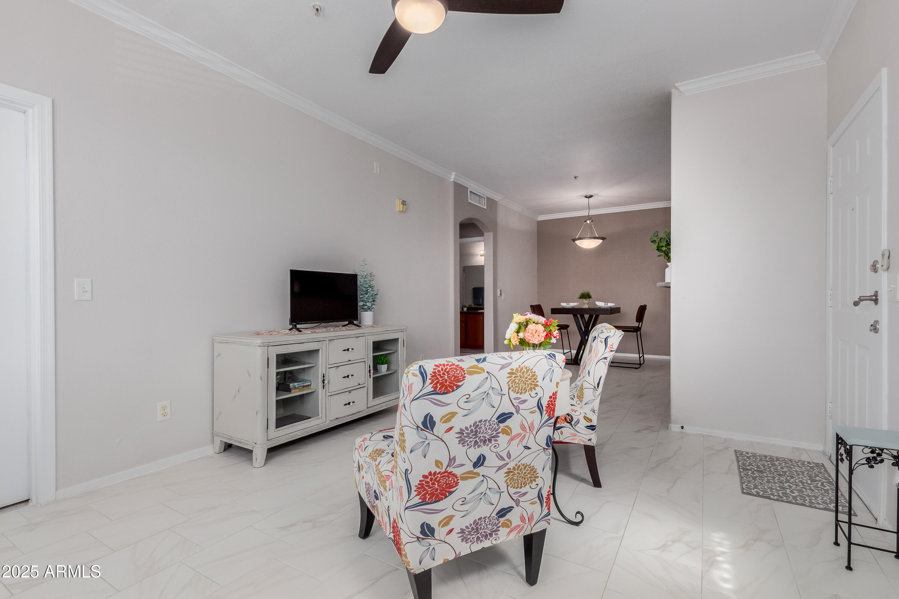1941 South Pierpont Drive, Unit 1114 Mesa, AZ 85206 - Photo 4 of 34 a living room with furniture and a flat screen tv