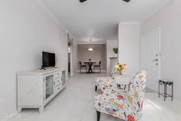 a living room with furniture and a flat screen tv