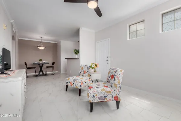 a bedroom with furniture and a chandelier