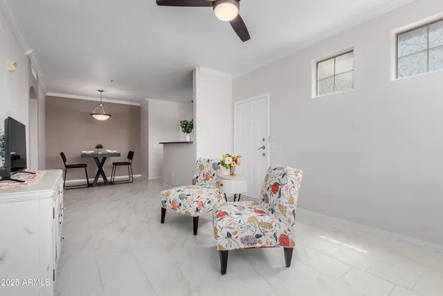 a bedroom with furniture and a chandelier