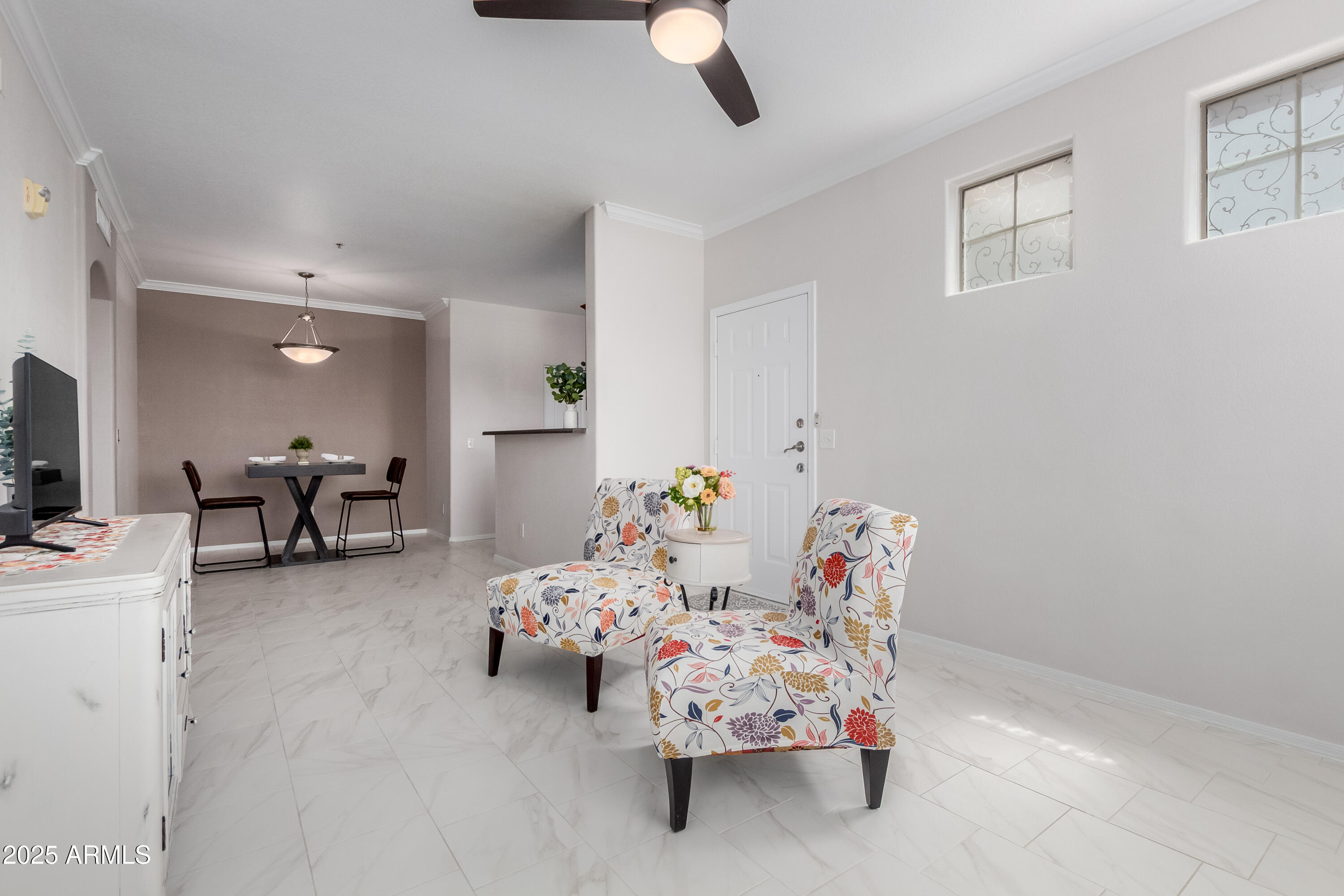 1941 South Pierpont Drive, Unit 1114 Mesa, AZ 85206 - Photo 6 of 34 a bedroom with furniture and a chandelier