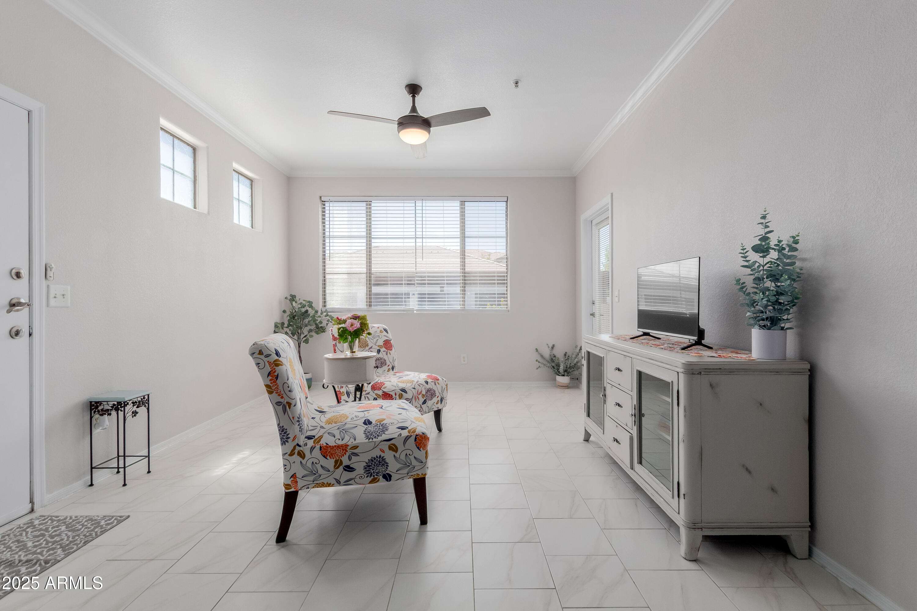 1941 South Pierpont Drive, Unit 1114 Mesa, AZ 85206 - Photo 7 of 34 a living room with furniture and a chandelier