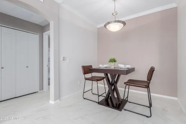 a dining room with furniture and window