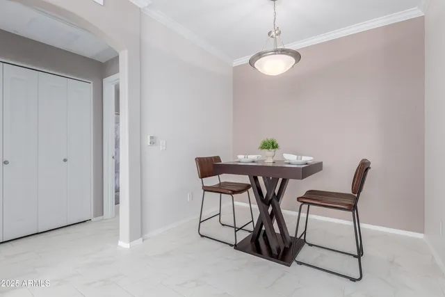 a dining room with furniture and window