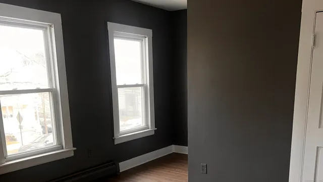 an empty room with a windows