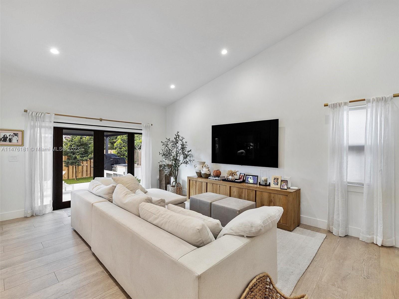 3776 Southwest 107th Court Miami, FL 33165 - Photo 11 of 45 a living room with furniture and a flat screen tv