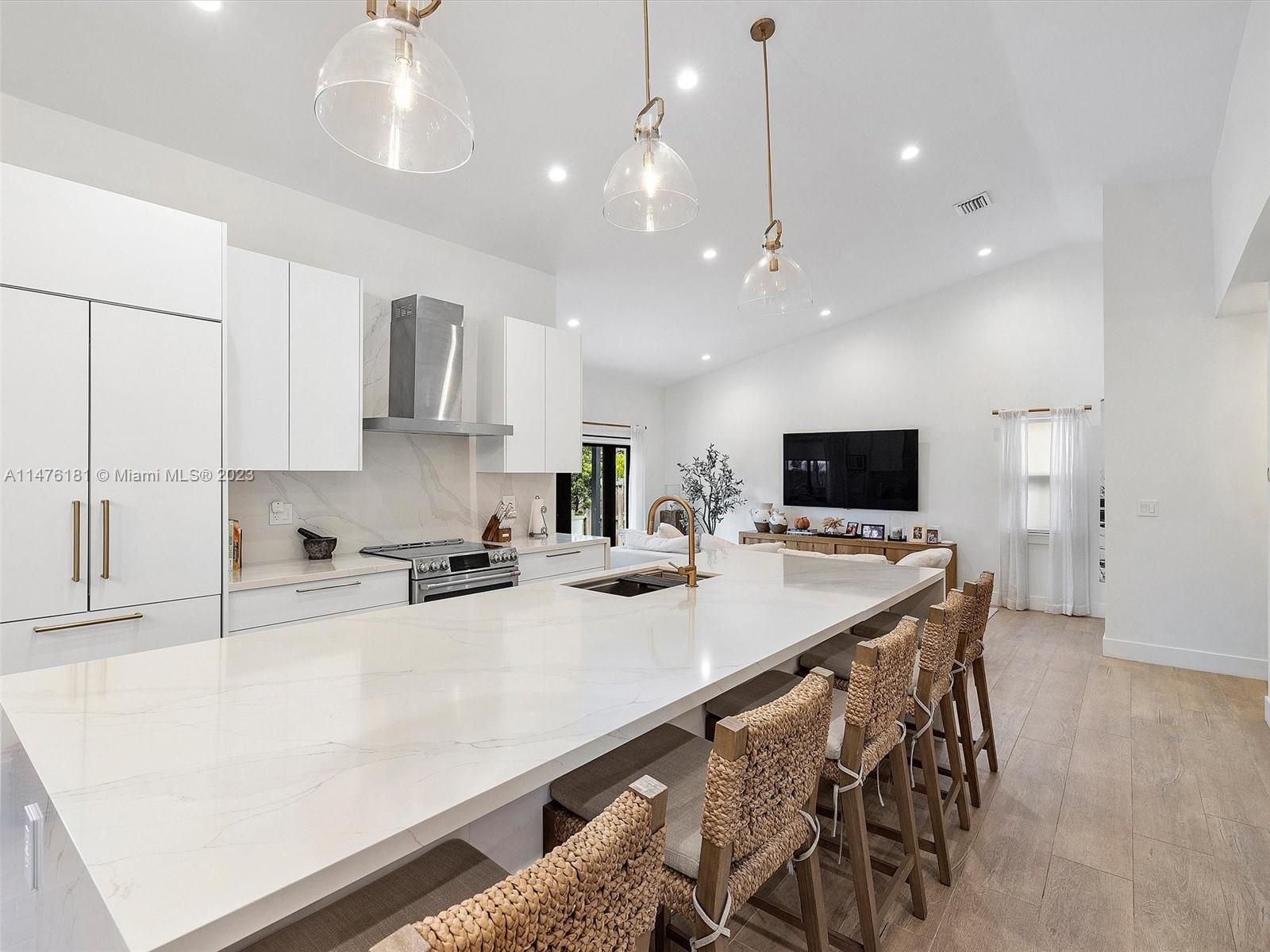 3776 Southwest 107th Court Miami, FL 33165 - Photo 12 of 45 a kitchen with stainless steel appliances a sink stove and refrigerator