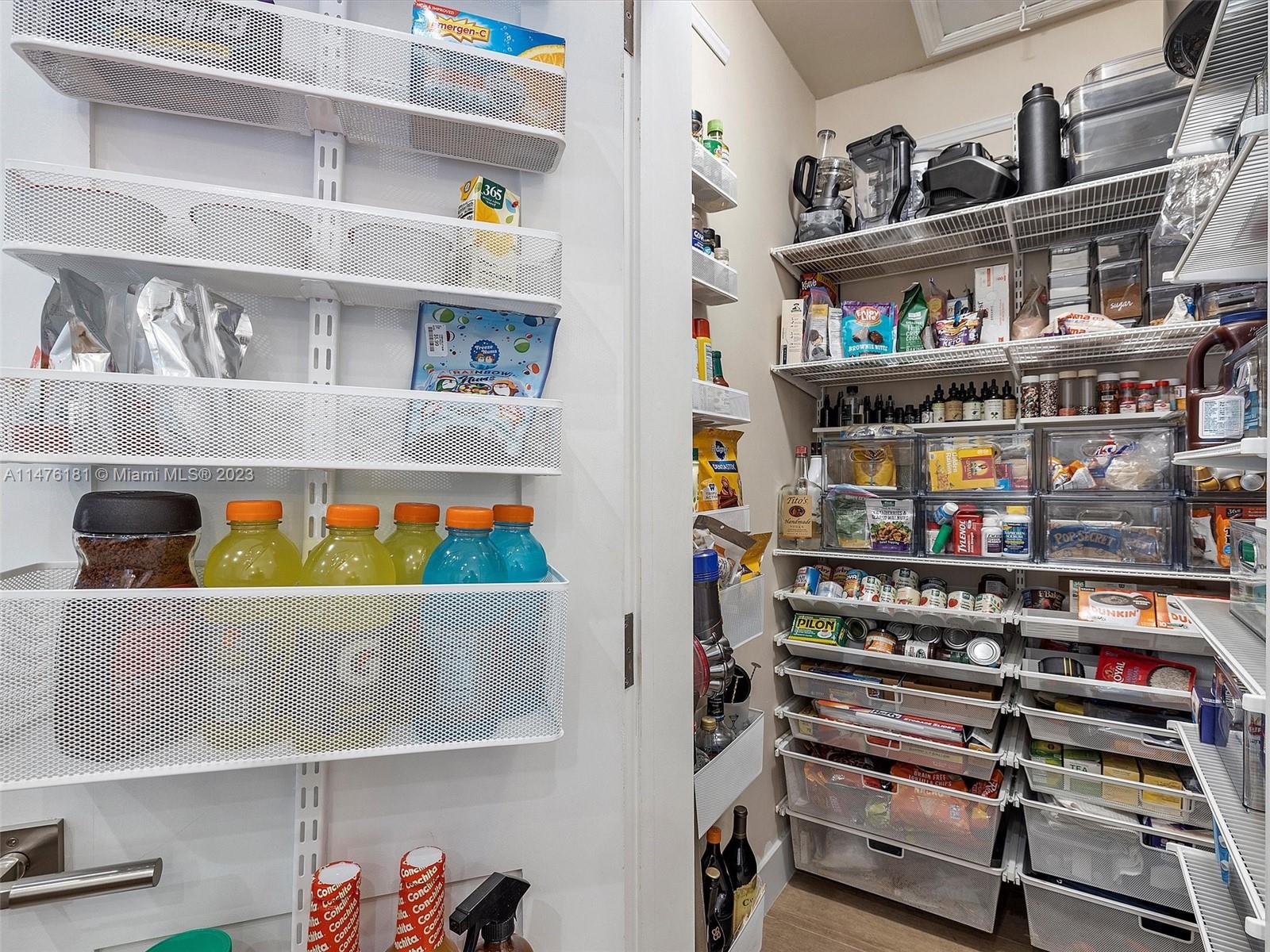 3776 Southwest 107th Court Miami, FL 33165 - Photo 21 of 45 a cabinet with books and a shelf