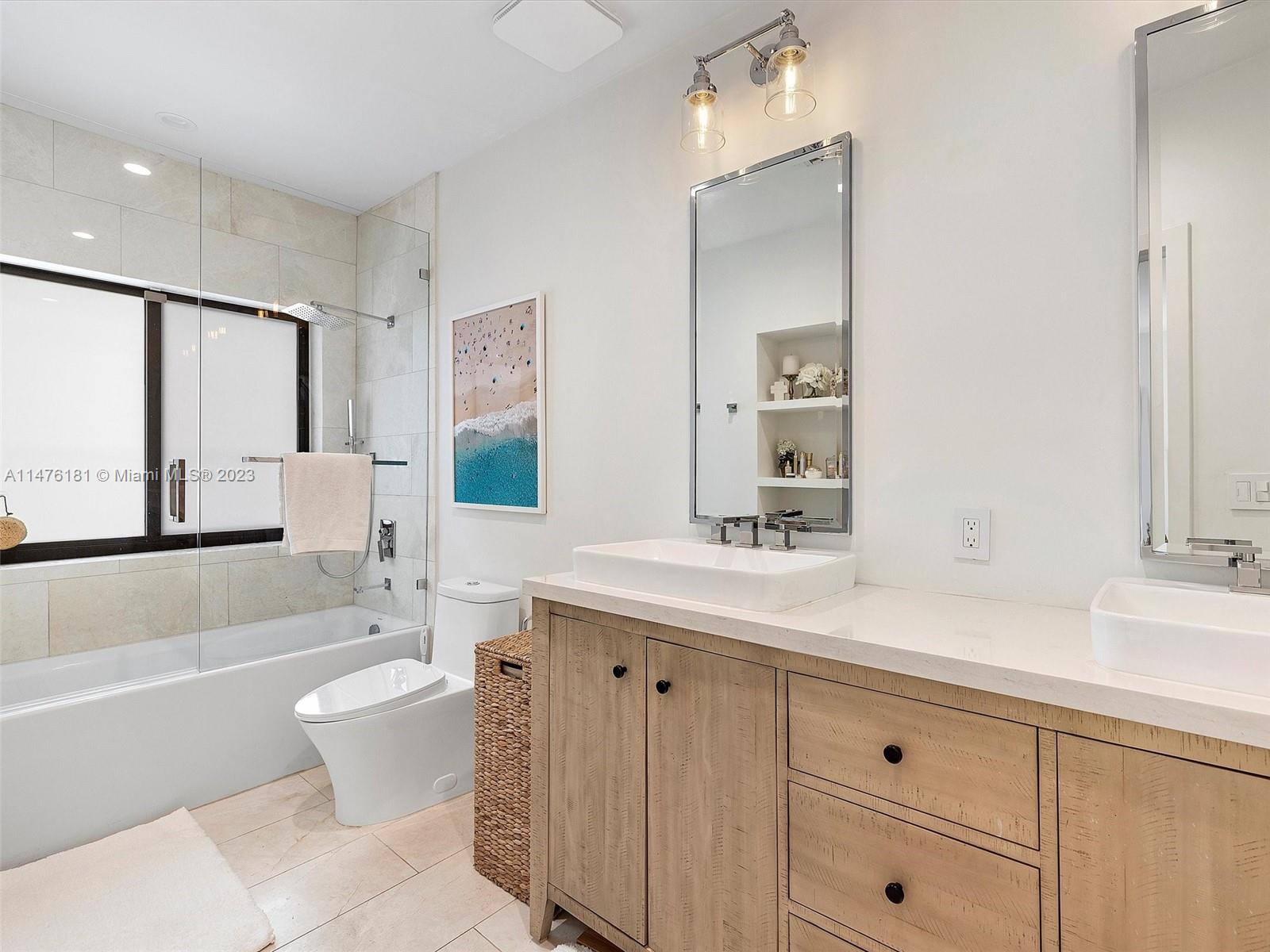 3776 Southwest 107th Court Miami, FL 33165 - Photo 28 of 45 a bathroom with a sink double vanity granite toilet tub and shower