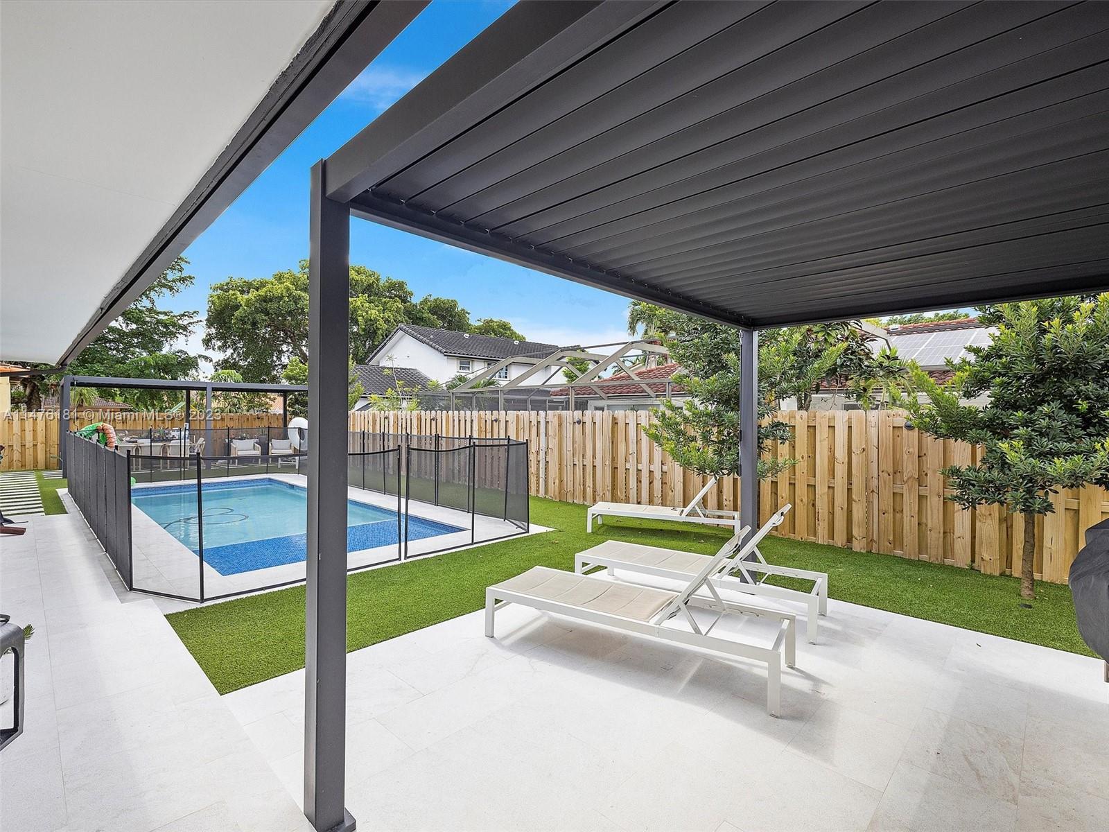 3776 Southwest 107th Court Miami, FL 33165 - Photo 36 of 45 a garden with trees in the back