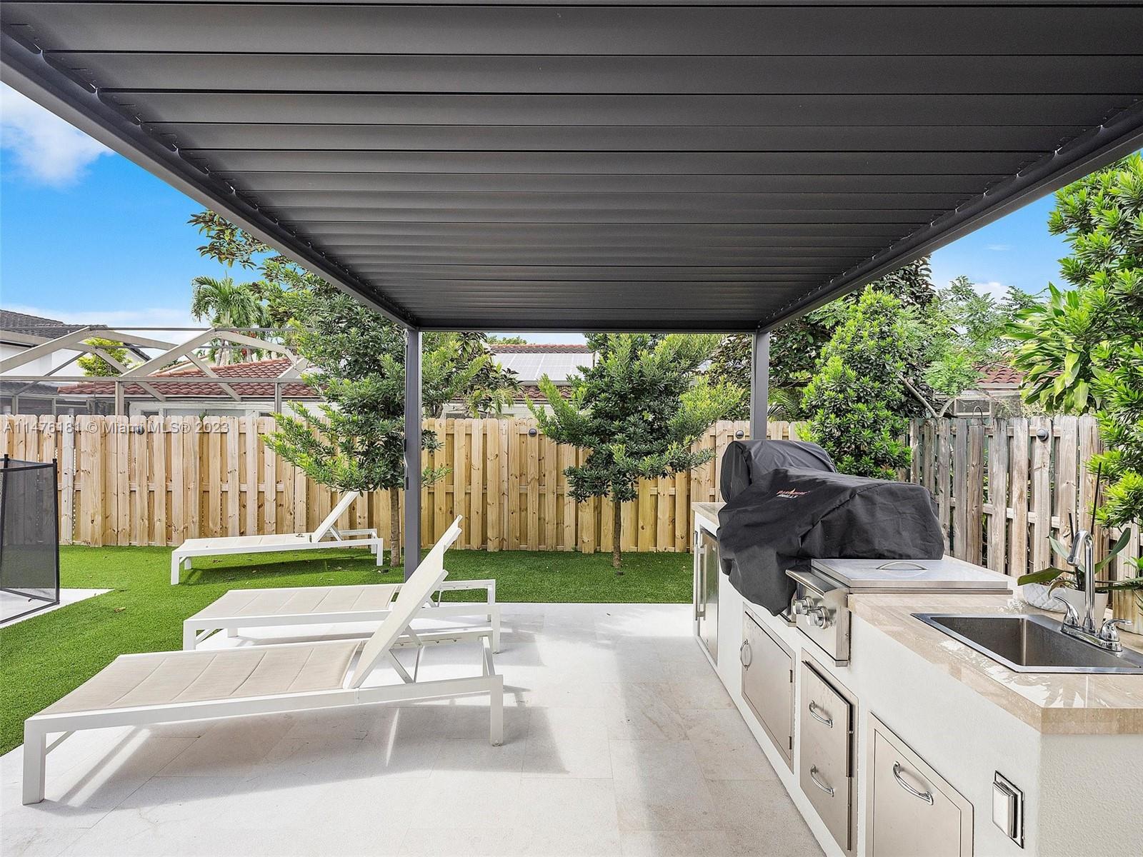 3776 Southwest 107th Court Miami, FL 33165 - Photo 37 of 45 a house view with a sitting space and garden view