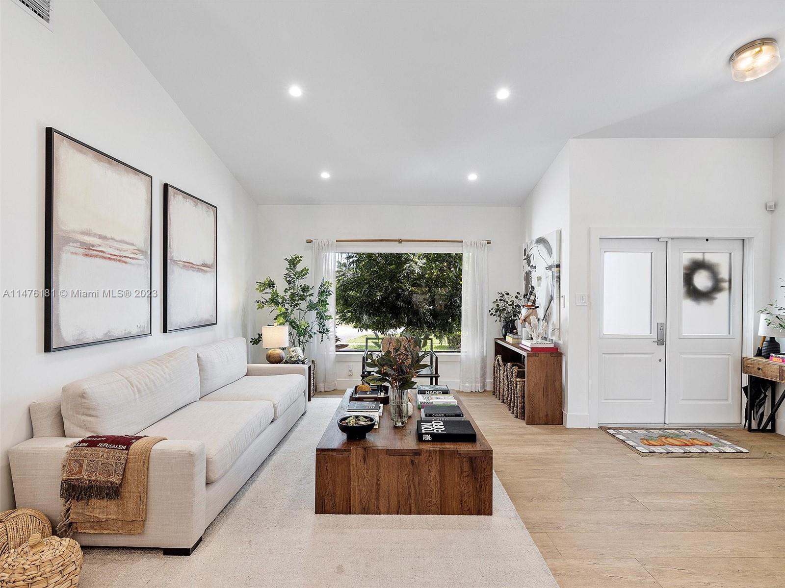 3776 Southwest 107th Court Miami, FL 33165 - Photo 4 of 45 a living room with furniture ceiling fan and a large window