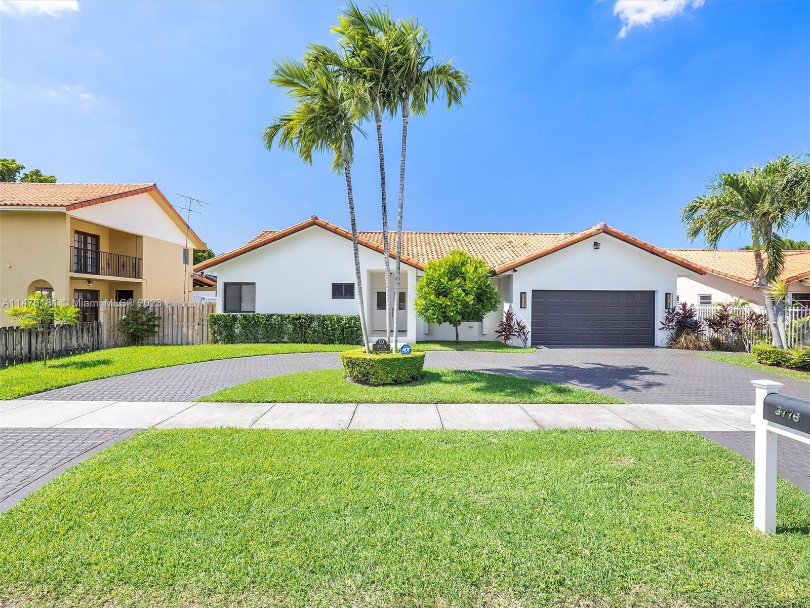 3776 Southwest 107th Court Miami, FL 33165 - Photo 43 of 45 a view of a house with a yard and potted plants