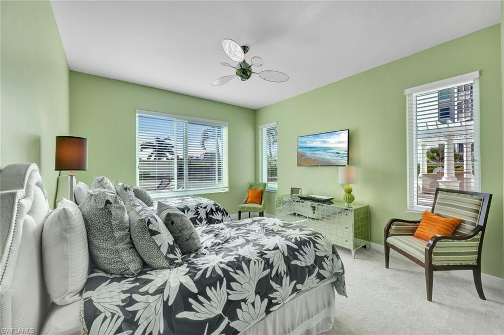 265 Indies Way, Unit T1 Naples, FL 34110 - Photo 8 of 21 a bed room with two bed and a window
