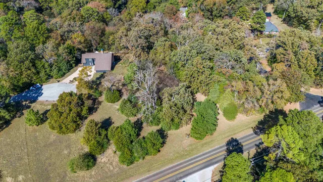 a view of a back yard from a balcony