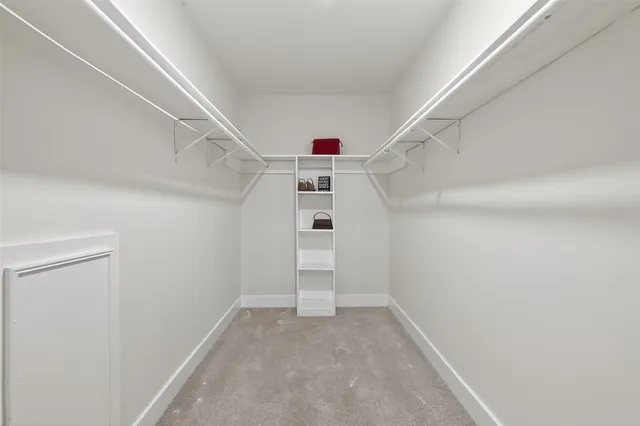 a view of a hallway to an empty room