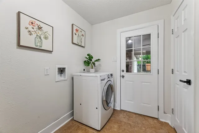a view of hallway with washer and dryer