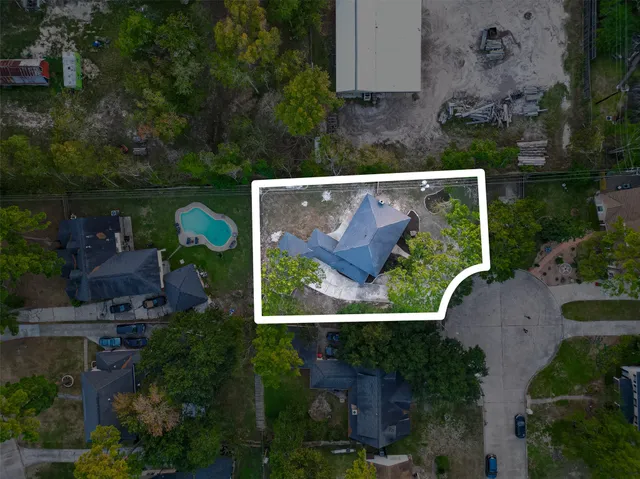 an aerial view of house with a yard