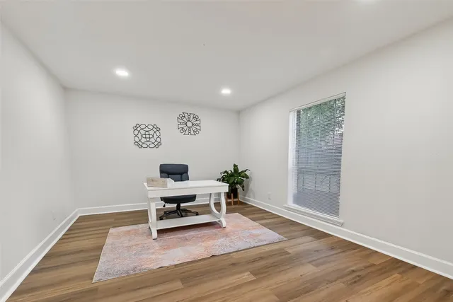 a view of a livingroom with wooden floor and a couch