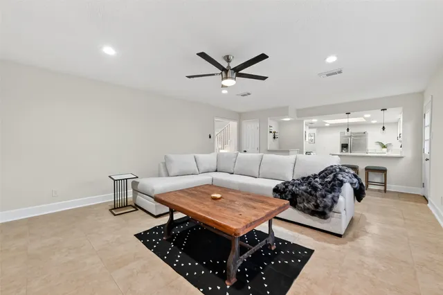 a living room with furniture and a rug
