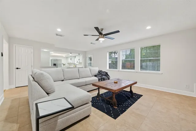 a living room with furniture and a window