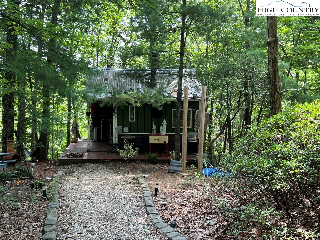 465 Shepherds Run Purlear, NC 28665 - Photo 6 of 47 a view of a house with backyard sitting area and garden