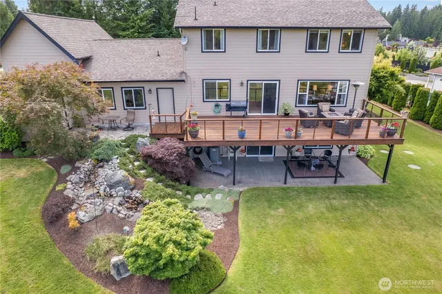 a aerial view of a house with table and chairs