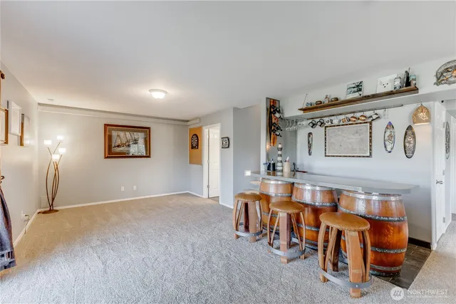 a bedroom with a bed and a table