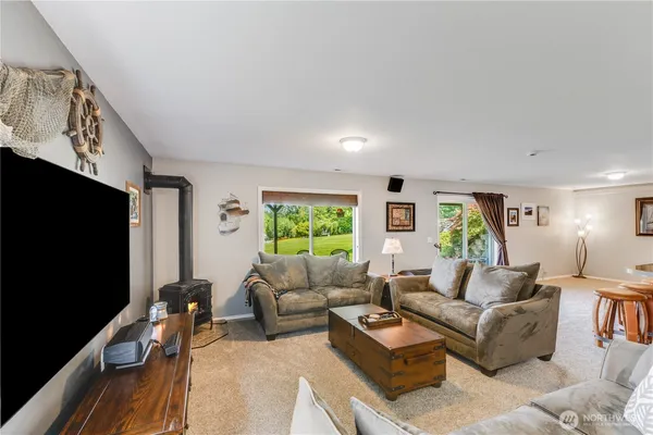 a view of a livingroom with furniture and window