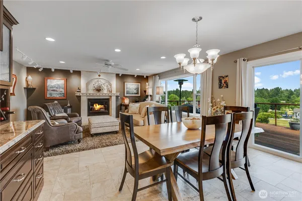 a view of a dining room with furniture window and outside view
